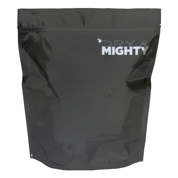 Opaque black resealable stand-up pouch with a white "DRY & MIGHTY" logo featuring a water droplet.