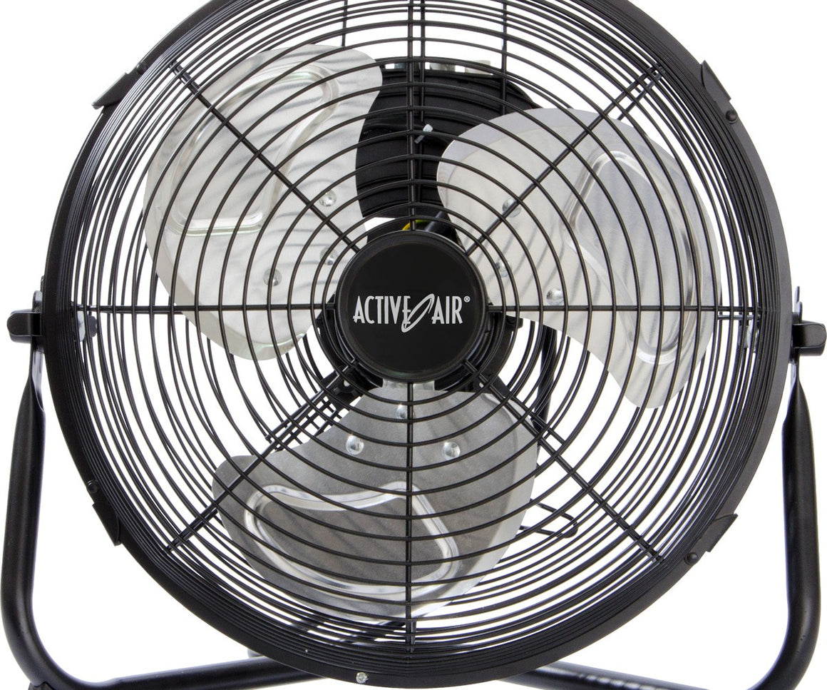Close-up of black Active Air HD floor fan with three metal blades and circular grate.