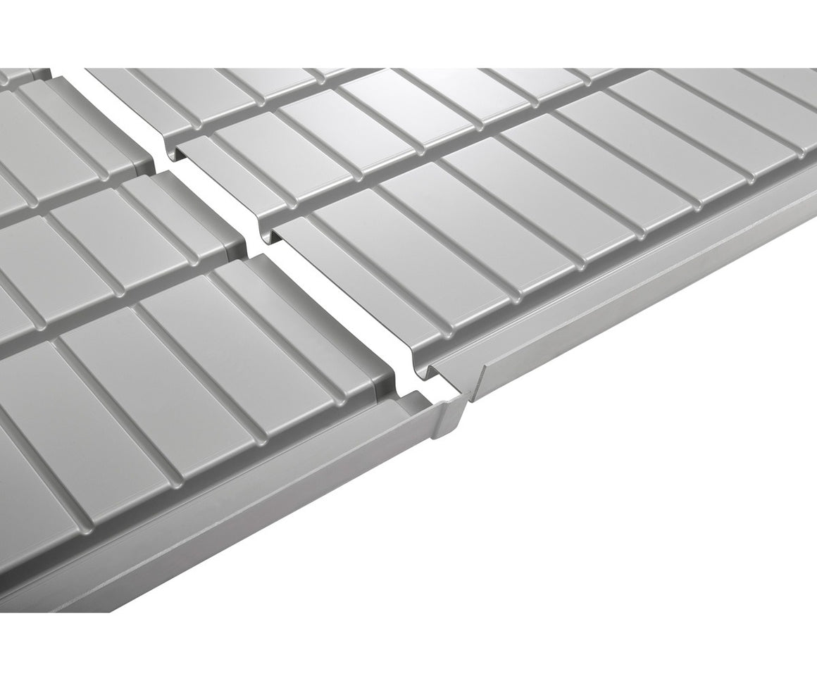 Silver hydroponic tray with ribbed surface and connecting channel.