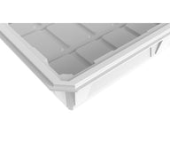 Close-up of a white, segmented plastic tray with clean, modern lines.