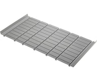 Silver metal drain grate with a ribbed surface and raised edges.