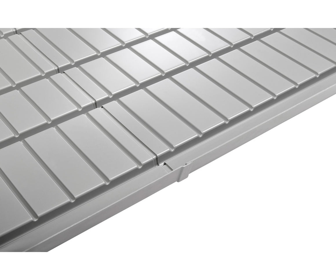 Gray hydroponic grow tray with ridged surface and a small gutter.