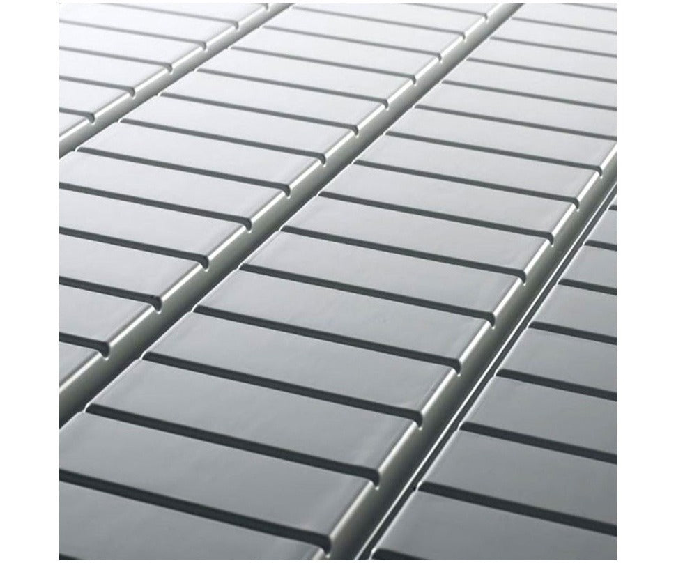 Close-up of a gray slatted shelf, showing parallel rows of smooth, rectangular bars with dark shadows.