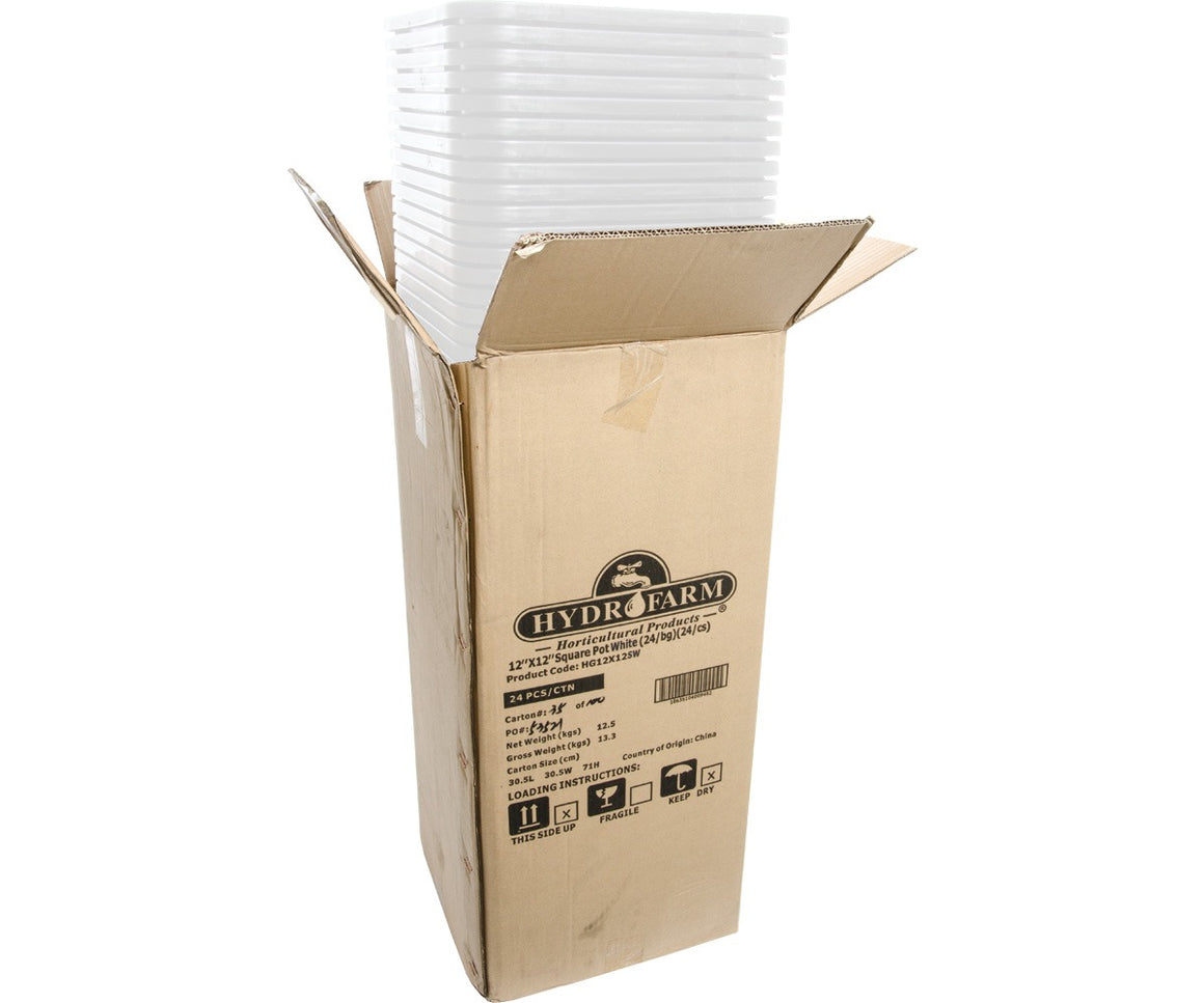 Open cardboard box filled with stacked white square horticultural pots.