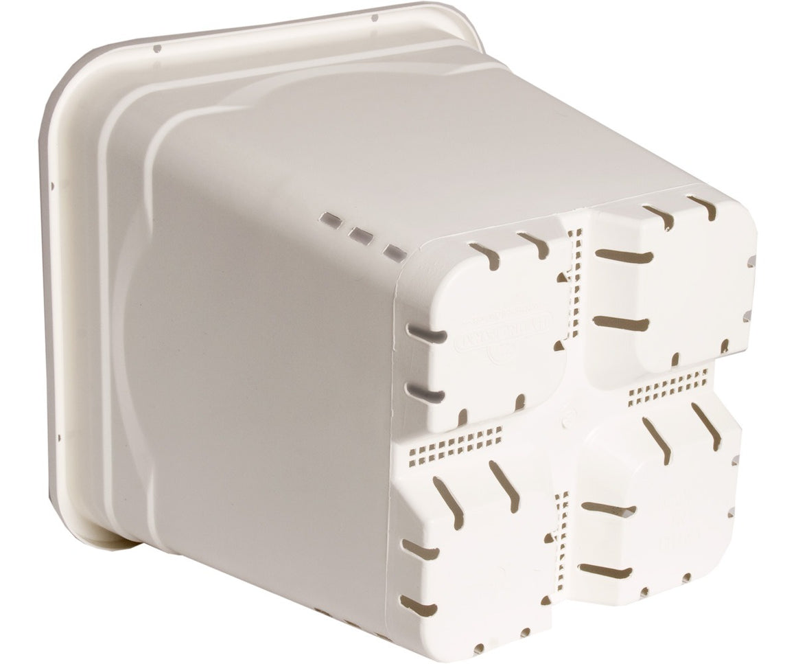 White plastic grow pot with drainage slits and square compartments on the bottom.