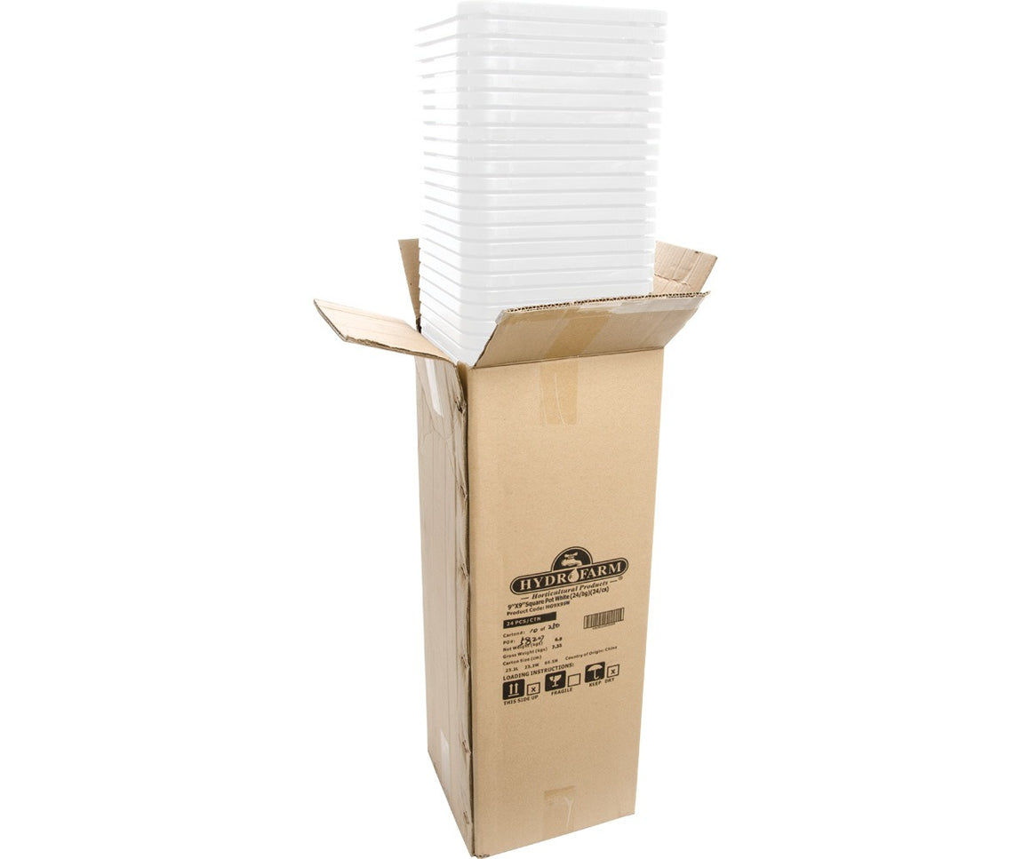 A cardboard box with a stack of white, square plant pots.