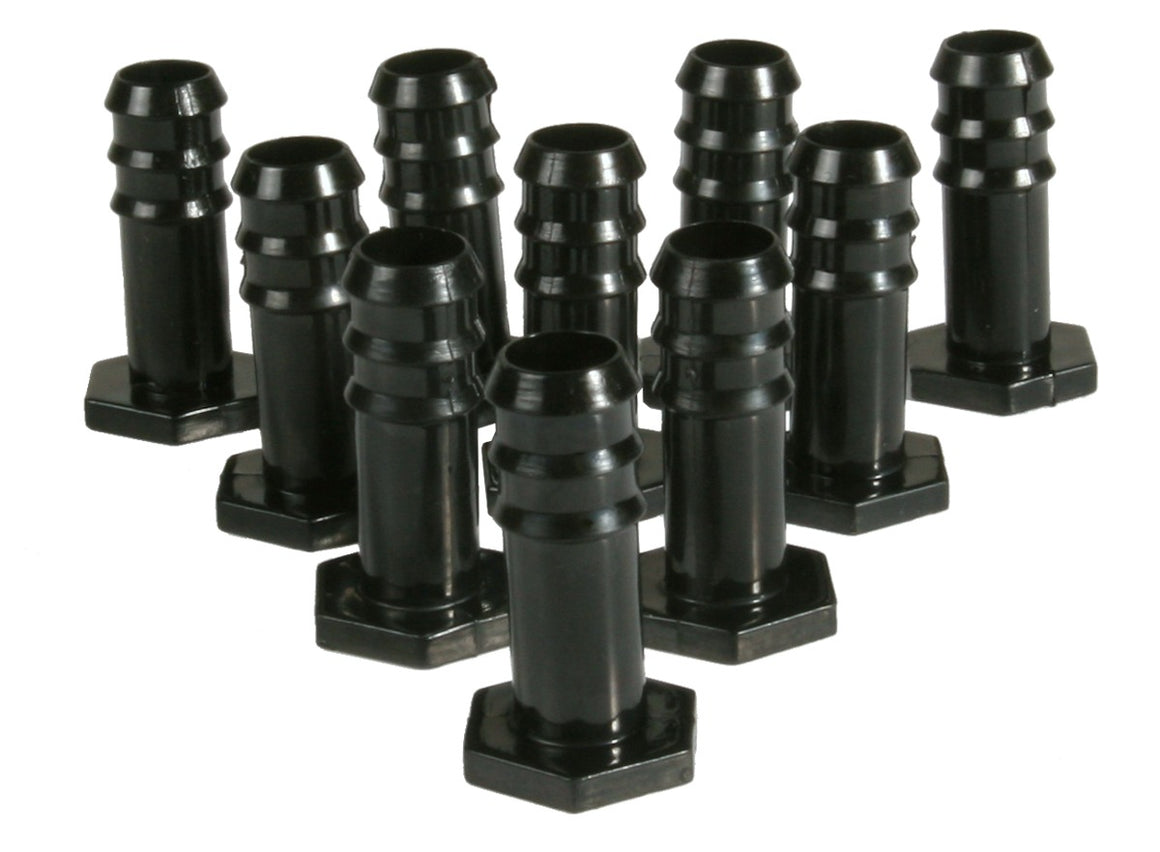 Black plastic barbed stoppers with hexagonal bases, arranged in a staggered pattern.