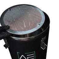Black hash washer with stainless steel lid. A person in a black glove holds the lid.