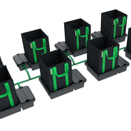 8-pot, 1-row hydroponic system with black fabric pots, green handles and tubing, and black drip trays.