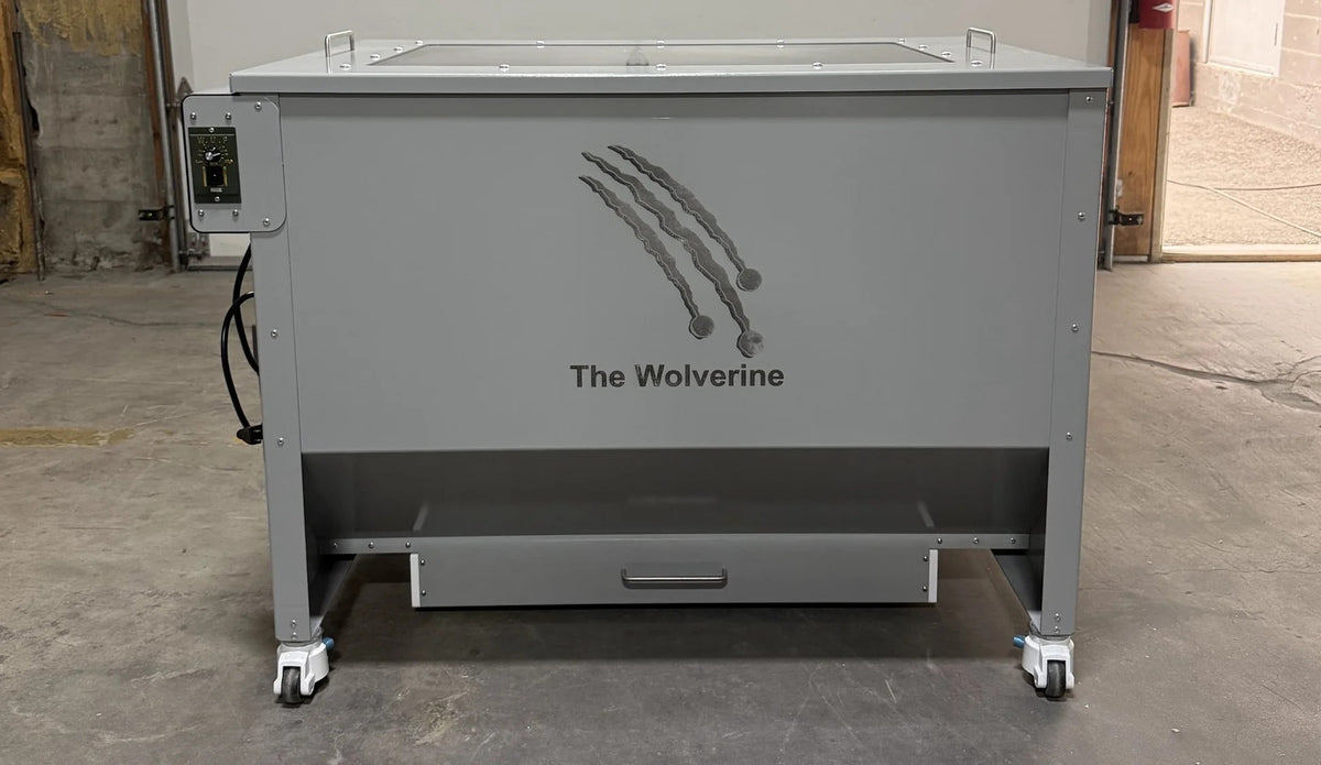 The Wolverine extraction tumbler, gray metal machine with claw logo and "The Wolverine" text.
