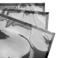 Black vacuum seal bags with dotted seal lines stacked.