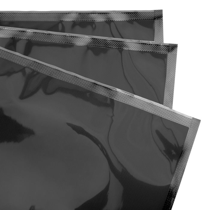Black vacuum seal bags, pre-cut, stacked, with dotted sealing edges.