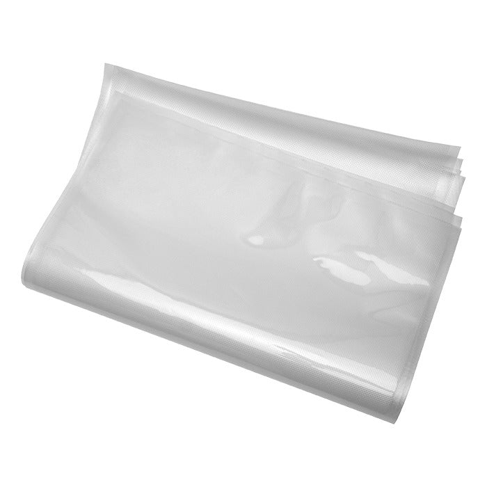Clear vacuum seal bags, stacked and angled, on a white background.