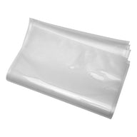 Clear vacuum seal bags, stacked and angled, on a white background.