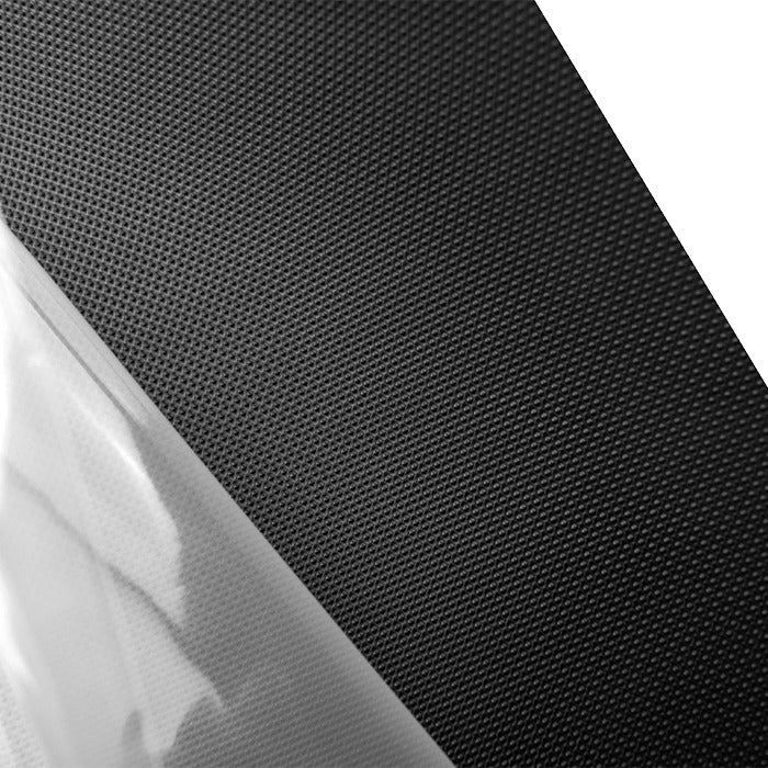 Black textured material diagonally cut with clear plastic.