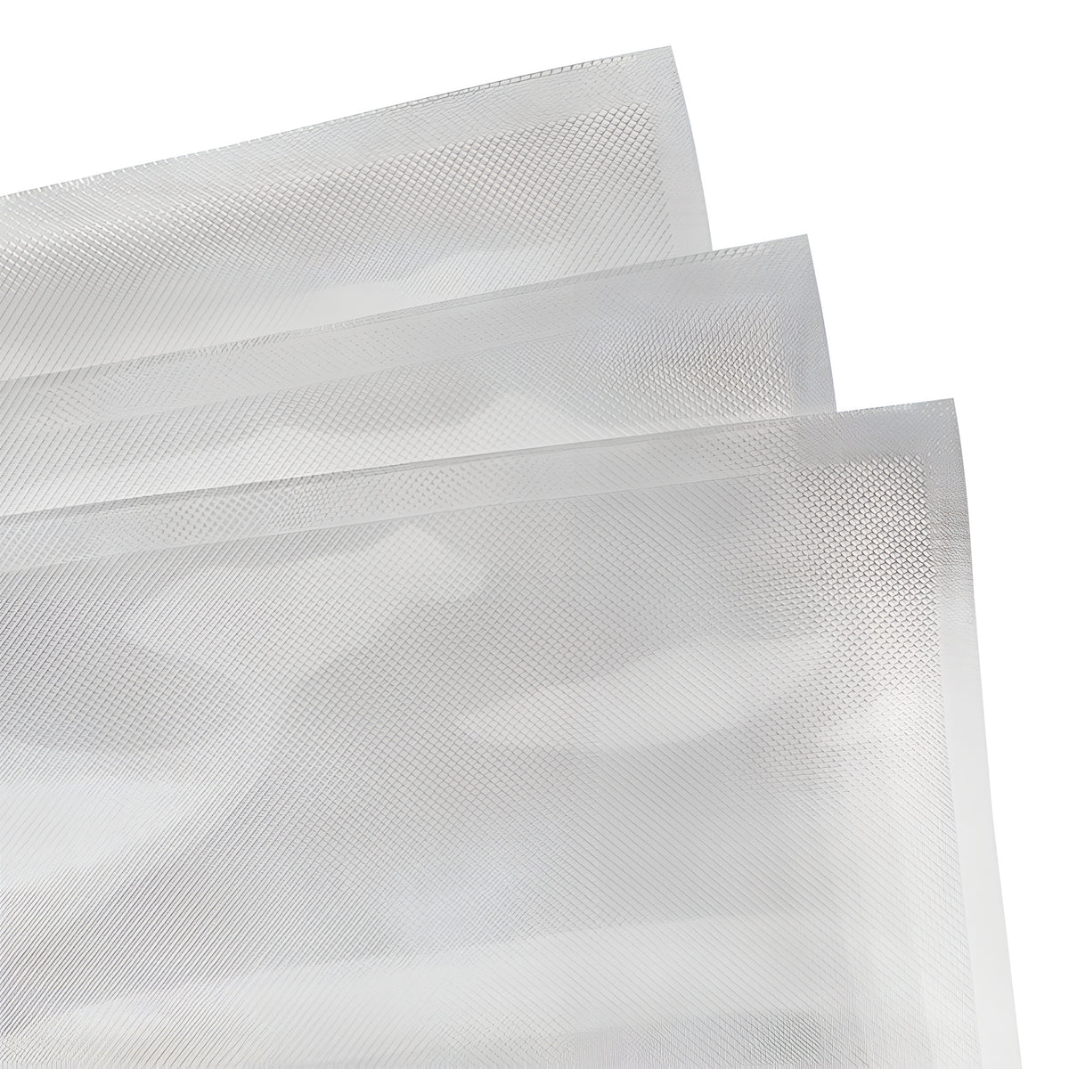 Three clear vacuum seal bags with textured surfaces, stacked and angled against a white background.