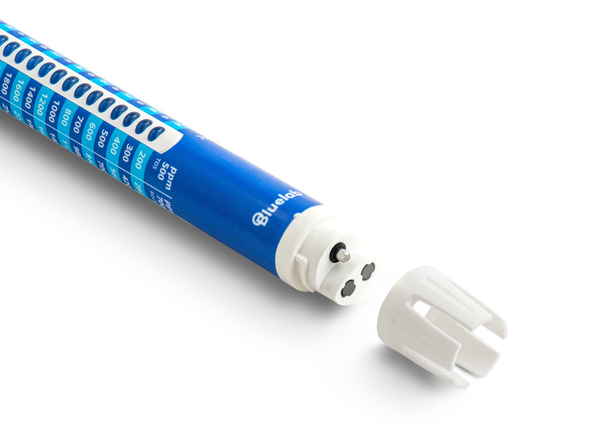 A blue and white Bluelab Truncheon nutrient meter with a black background and detached white cap.