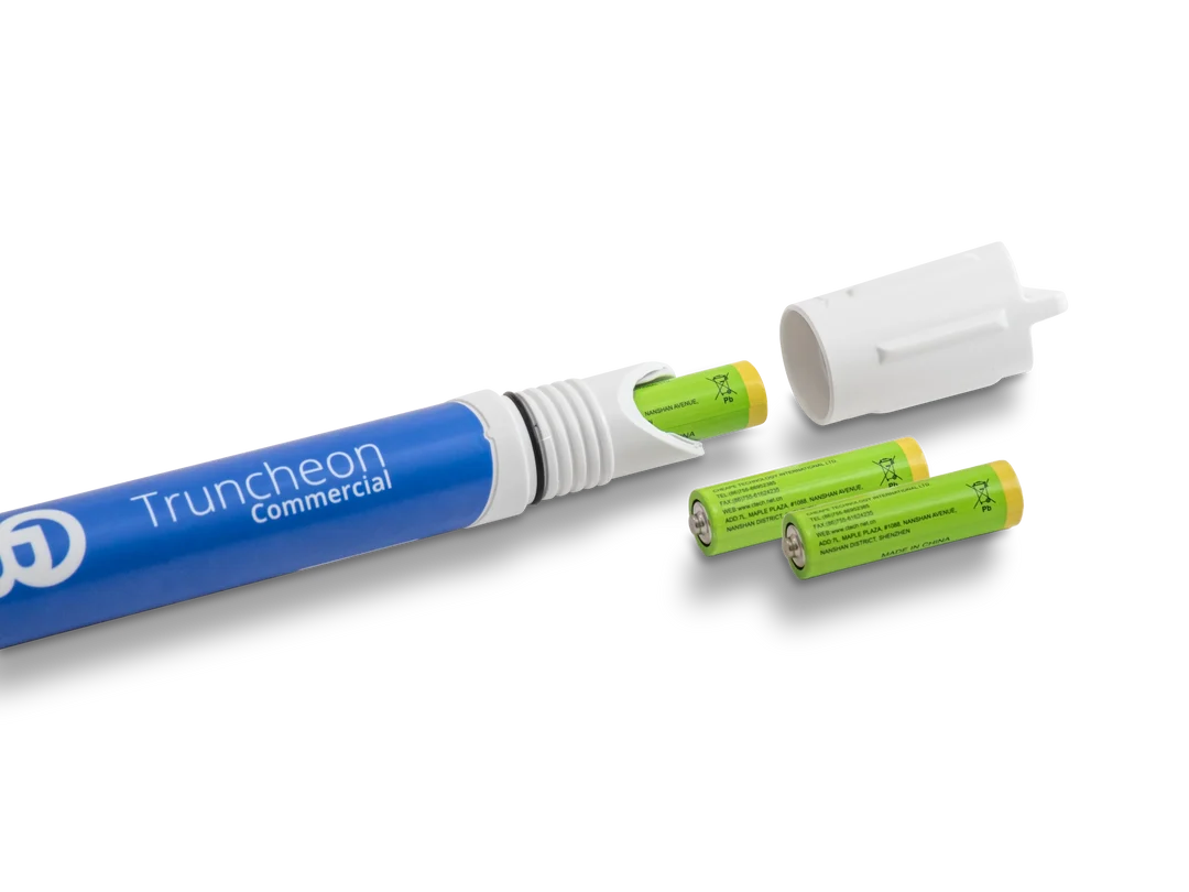 Blue Truncheon Commercial nutrient meter with batteries and cap, isolated on black.