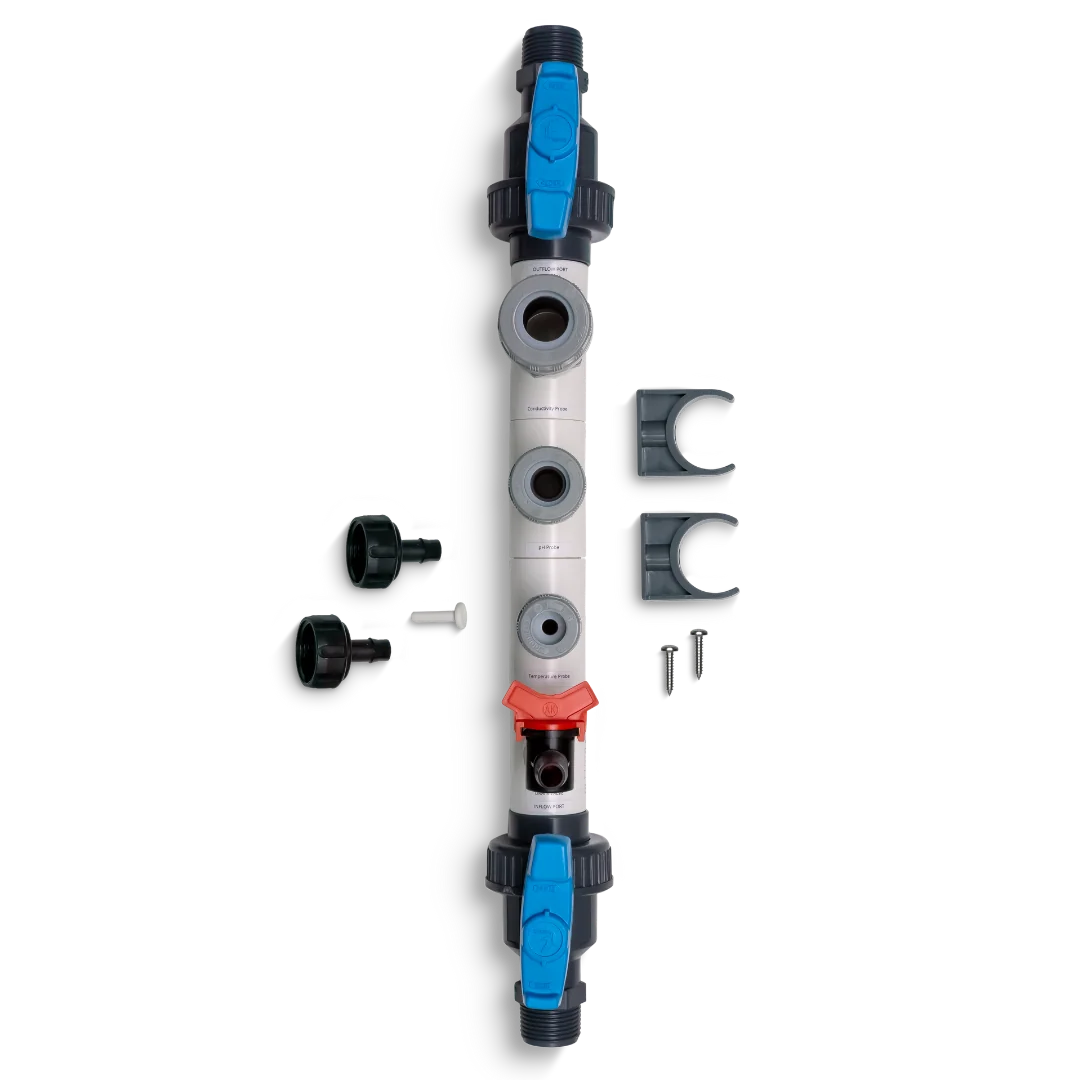 Vertical pipe fitting with blue valves, various ports, and accessories, against a black background.