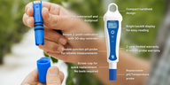 Blue and white Bluelab pH PenPlus meter held by hand, featuring a screen and digital display.