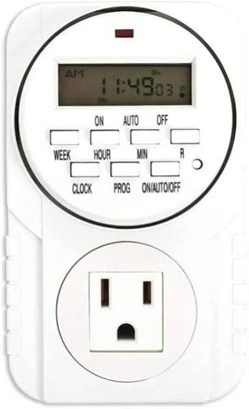 White digital timer with LCD screen displaying time, buttons for programming, and a power outlet.