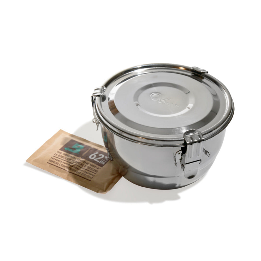 A stainless steel CVault container with a Boveda 62% humidity pack.