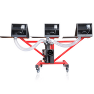 A red metal bucking machine with three black bins and flexible hoses, mounted on wheels.