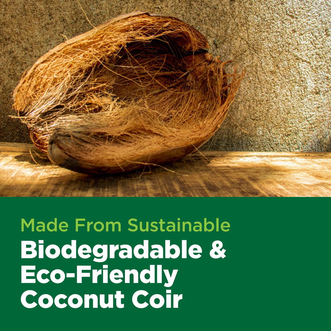 Coconut coir fiber in a brown husk lies on a wooden surface, with green text overlay reading "Made From Sustainable Biodegradable & Eco-Friendly Coconut Coir."