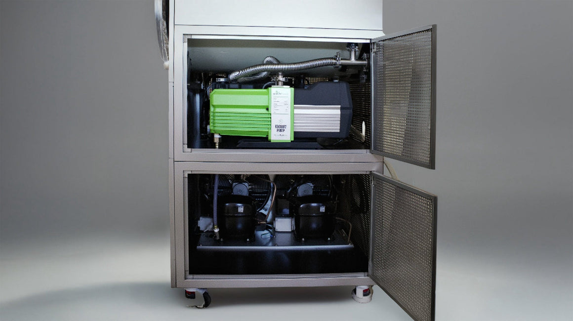 Two compartments of a commercial vacuum pump unit are shown, with one compartment open to reveal a green vacuum pump.