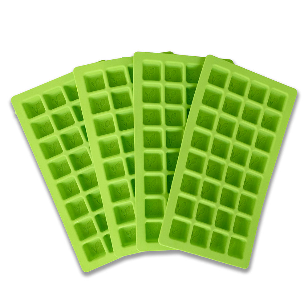 Four green silicone candy molds with embossed leaf designs, arranged fanned out.