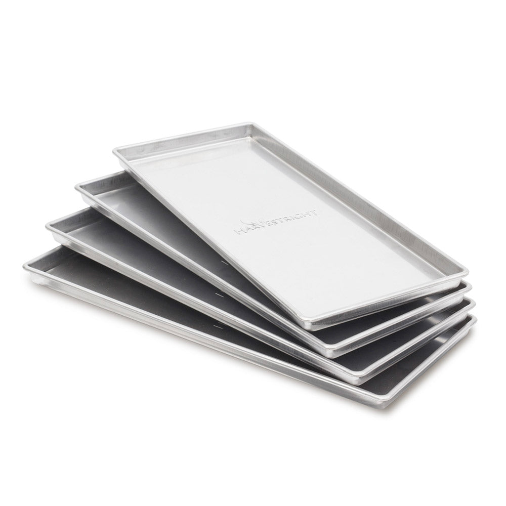 Stack of five silver rectangular trays with a textured logo reading "HARVESTRIGHT" on the top tray.