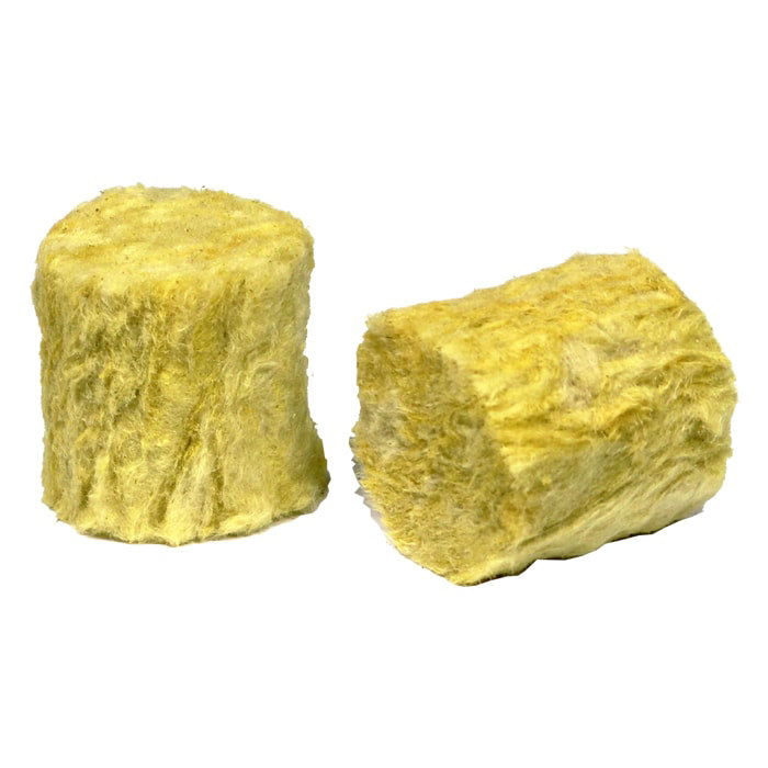 Two yellow, fibrous Cultiwool Round Macro Plugs for propagation; one upright, one on its side, on white.