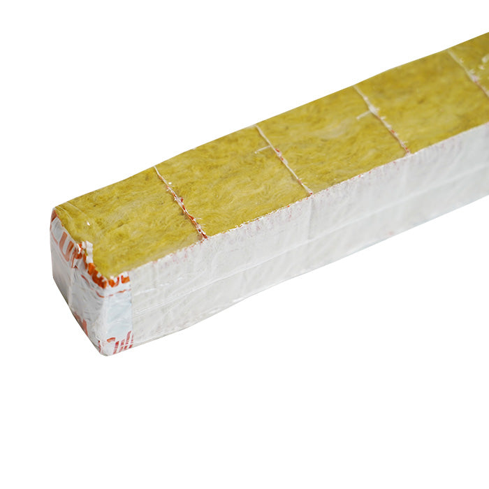 Rectangular Cultiwool rockwool grow slab, yellow fibrous material wrapped in clear plastic and white segmented packaging.