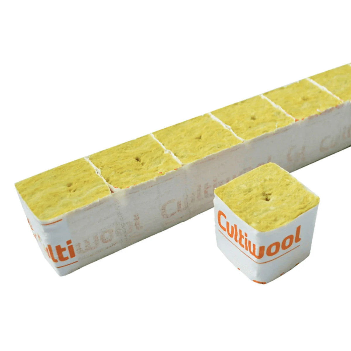 Cultiwool rockwool hydroponic growing media. Yellow seed starter cubes with holes, one separated from a scored strip.