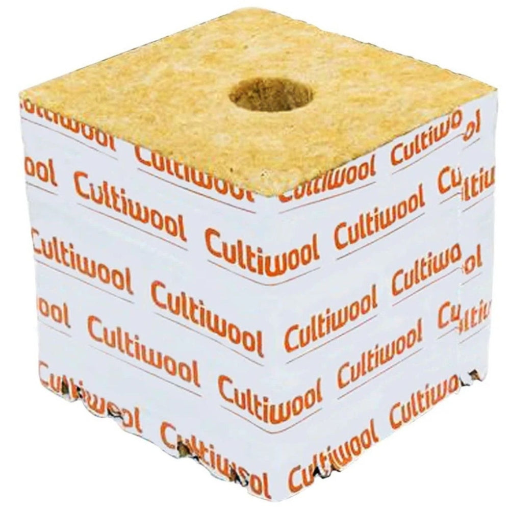 A single Cultiwool growing block with a hole in the center, wrapped in white paper with orange text.