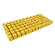 Yellow 84-cell Cultiwool rooting plug sheet, a fibrous grow medium for plant propagation, isolated on a white background.