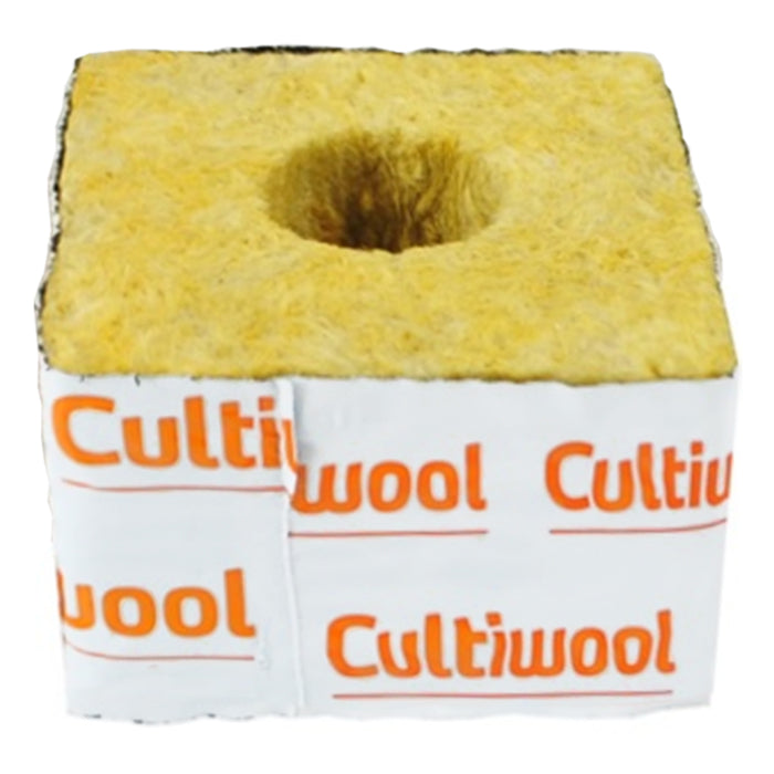 Yellow fibrous Cultiwool rockwool starter cube with central hole and white label for hydroponic growing.
