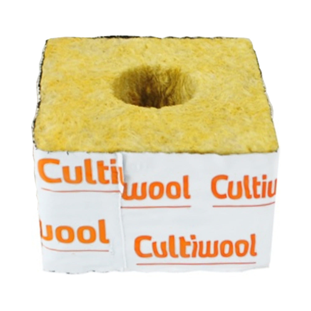 Yellow fibrous Cultiwool rockwool starter cube with central hole and white label for hydroponic growing.