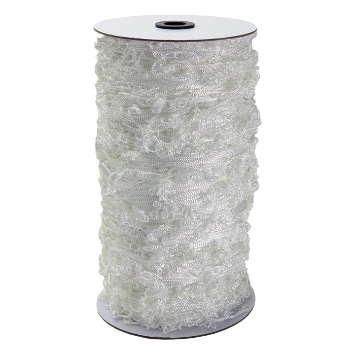 White ruffled netting on a spool.
