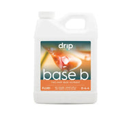 White jug of Drip Hydro Base B two-part nutrient. Image shows plant leaf with water droplets.