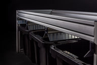 EZTrim BudSorter Mini detail: Aluminum frame and black bins, some with labels.