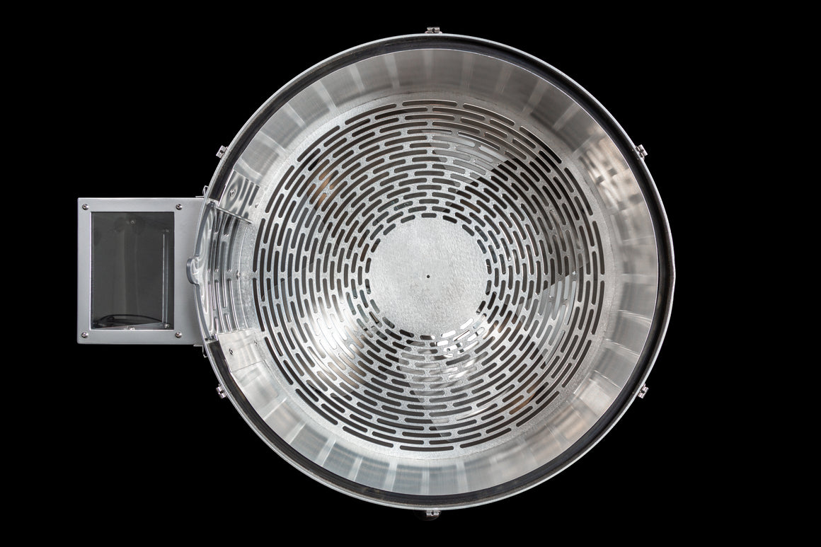 Top-down view of a silver bud trimmer with a circular, perforated metal grate.