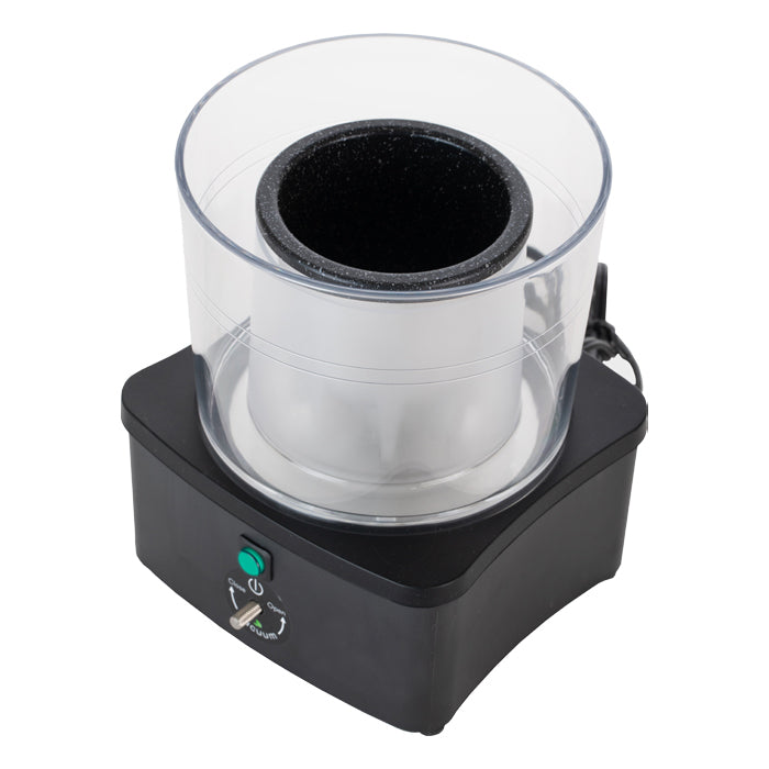 Black and clear elemental extractor with green power button and vacuum dial.