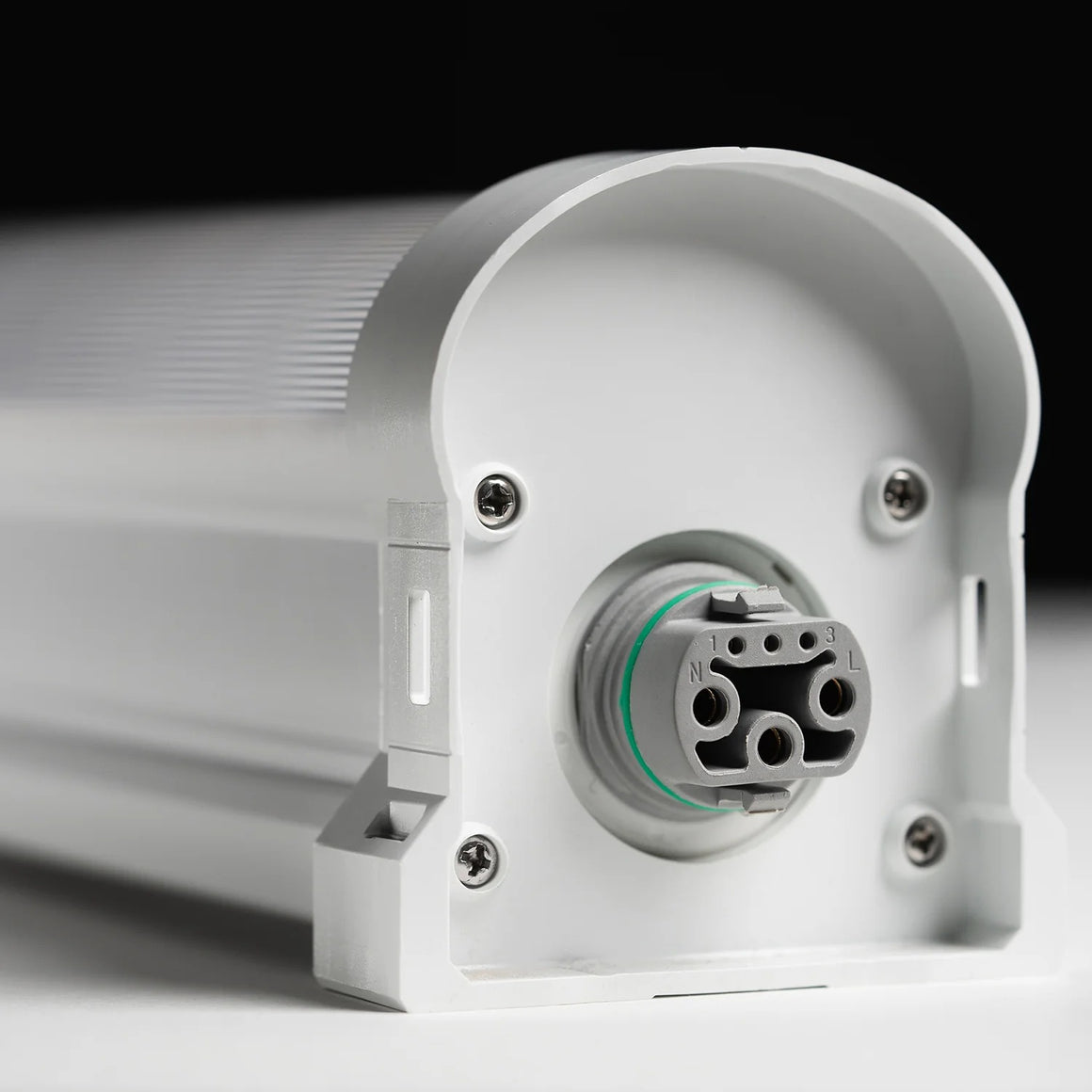Close-up of a white fixture's electrical connector with "N", "1", "3", and "L" markings.