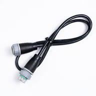 A black jumper cable with two gray and black connectors on a white background.