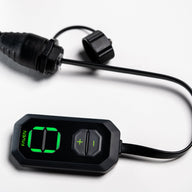 A black Faven remote with green digital display showing 