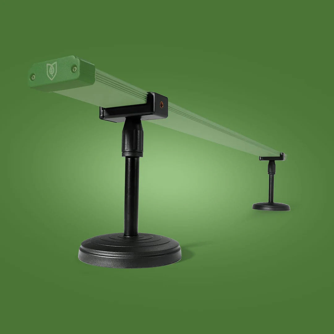 FloraFlex Under Canopy Adjustable Stand Setup with a long green bar supported by two black adjustable stands on a green background.