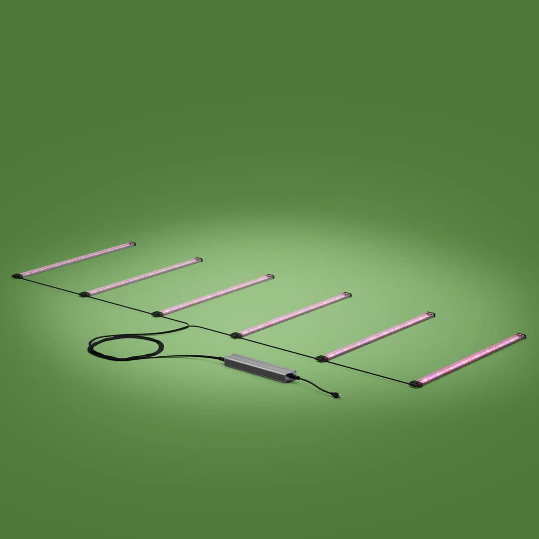 FloraFlex 6-bar 720W far red LED grow light setup, connected to a power supply, on a green background.