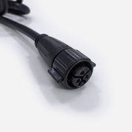 Black FloraFlex 12AWG extension power cord with a black 3-pin circular connector on a white background.