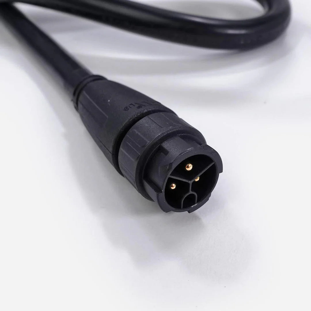 Black extension power cord with a 3-pin male electrical connector and gold pins on a white background.